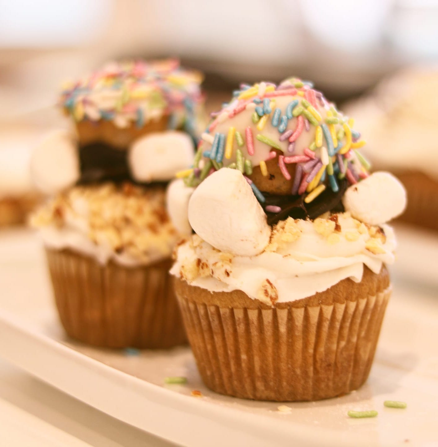 Donut hole topped cupcake with marshmellows